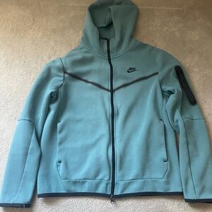 Nike Teal and Black Apparel Tag